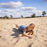 Children playing in the dunes of Loonse and Drunen at Het Genieten