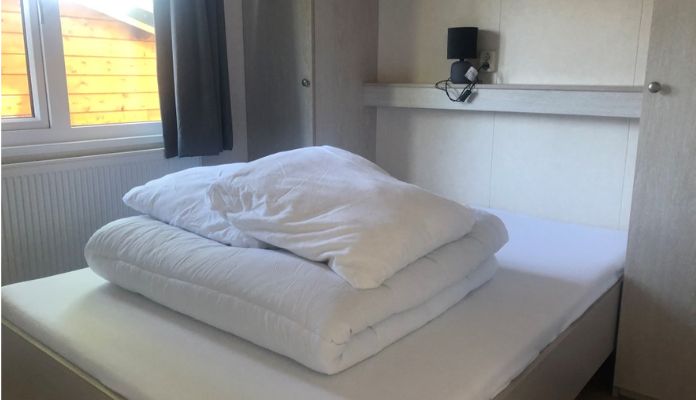 Double bed in Comfort range master bedroom at Het Genieten